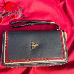 Chic Black and Red Clutch with Gold Accent